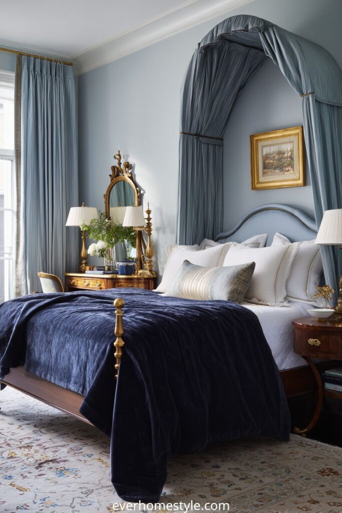 Luxury classic bedroom with blue velvet bed and gold accents.