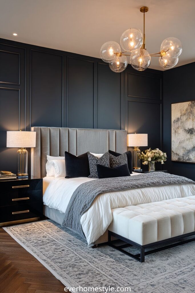 Modern bedroom with dark walls, upholstered bed, and elegant lighting.