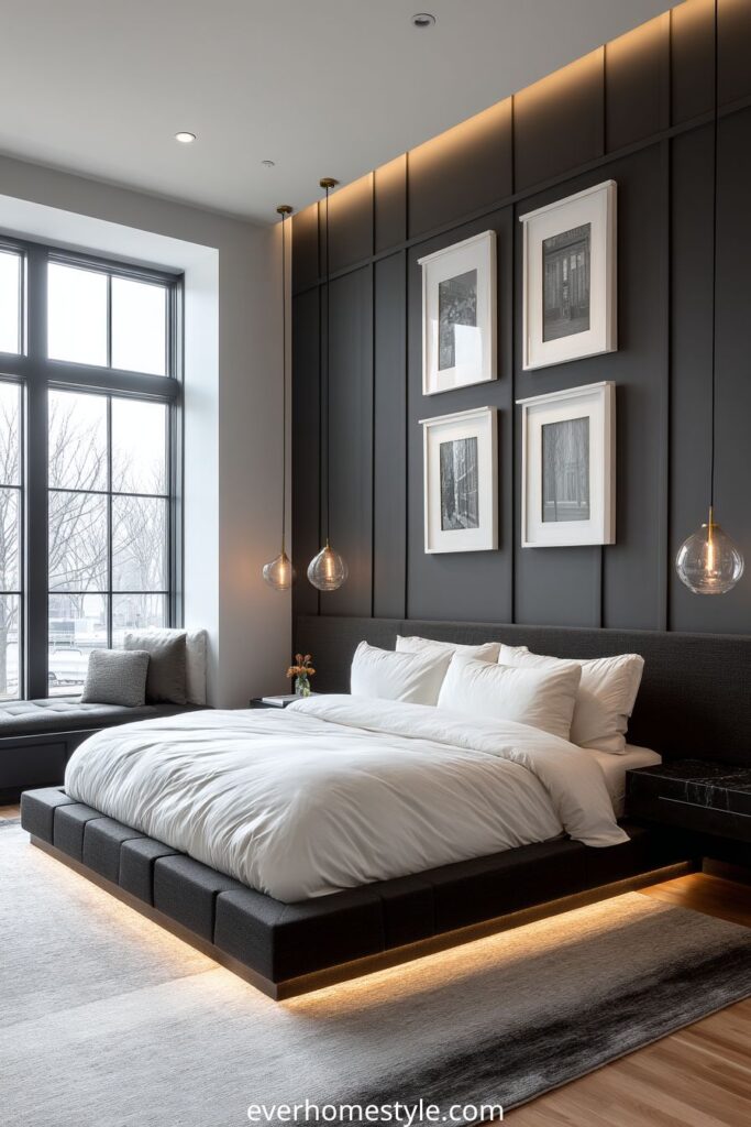 Modern bedroom with black accent wall, white bedding, pendant lights, and under-bed LED lighting.